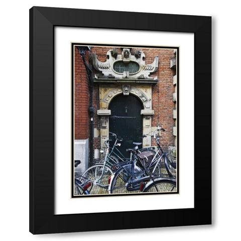 Netherlands, Amsterdam Bicycles by building door Black Modern Wood Framed Art Print with Double Matting by Flaherty, Dennis