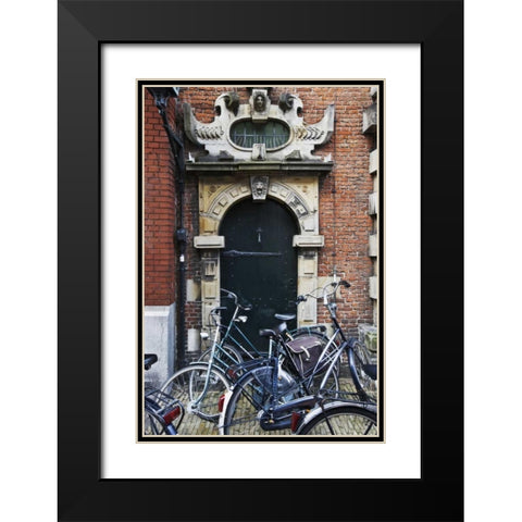 Netherlands, Amsterdam Bicycles by building door Black Modern Wood Framed Art Print with Double Matting by Flaherty, Dennis