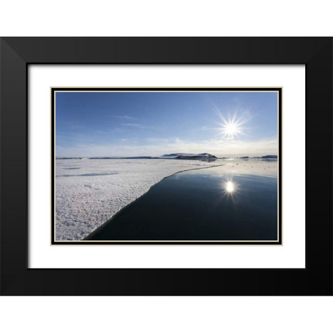 Svalbard Sunburst reflected in still water Black Modern Wood Framed Art Print with Double Matting by Young, Bill