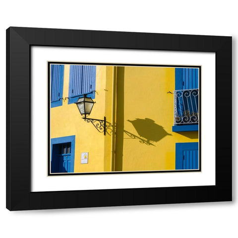 Portugal-Aveiro-Shadow of street lantern on colorful yellow building with bright blue shutters Black Modern Wood Framed Art Print with Double Matting by Eggers, Julie