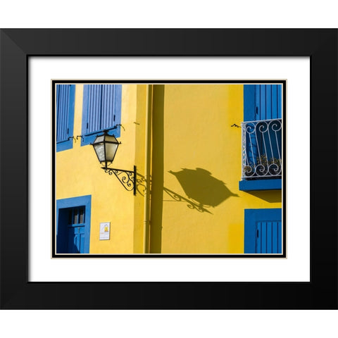 Portugal-Aveiro-Shadow of street lantern on colorful yellow building with bright blue shutters Black Modern Wood Framed Art Print with Double Matting by Eggers, Julie