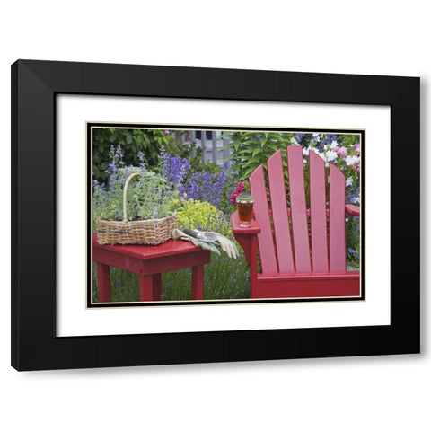 Ice tea rests on red chair while gardening Black Modern Wood Framed Art Print with Double Matting by Paulson, Don