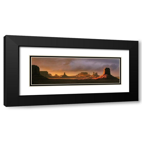 Last light bathes Monument Valley in deep oranges and lavenders on the Arizona-Utah border Black Modern Wood Framed Art Print with Double Matting by SMO