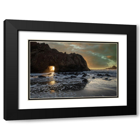 Sunset shines through a tunnel in this sea rock at Big Sur. Black Modern Wood Framed Art Print with Double Matting by Sederquist, Betty