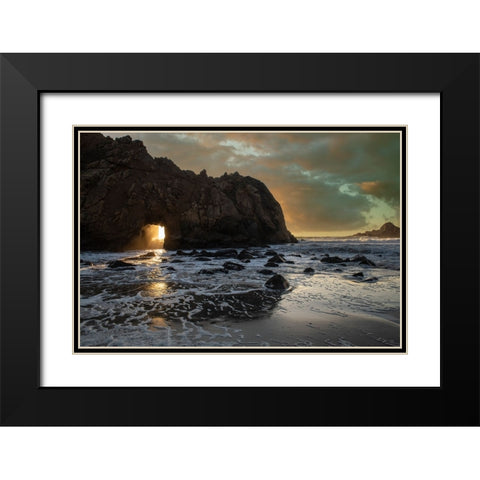 Sunset shines through a tunnel in this sea rock at Big Sur. Black Modern Wood Framed Art Print with Double Matting by Sederquist, Betty