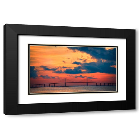 The Skyway Bridge over the Gulf of Mexico with the reds and oranges of the sunrise in the sky Black Modern Wood Framed Art Print with Double Matting by Haddad, Sheila