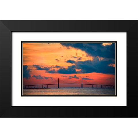 The Skyway Bridge over the Gulf of Mexico with the reds and oranges of the sunrise in the sky Black Modern Wood Framed Art Print with Double Matting by Haddad, Sheila