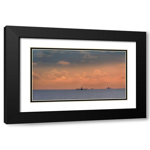 Fishing boats deep out to sea against the backdrop of dramatic sunset clouds and sky Black Modern Wood Framed Art Print with Double Matting by Haddad, Sheila