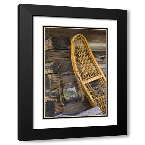 MT, A lantern and snowshoe outside a log cabin Black Modern Wood Framed Art Print with Double Matting by Paulson, Don