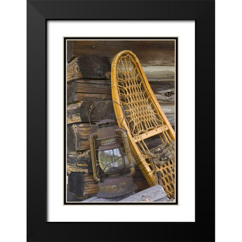 MT, A lantern and snowshoe outside a log cabin Black Modern Wood Framed Art Print with Double Matting by Paulson, Don
