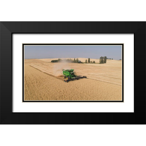 Aerial view of a John Deere combine cutting wheat on a sunny afternoon-Spokane County Black Modern Wood Framed Art Print with Double Matting by Probst, Greg