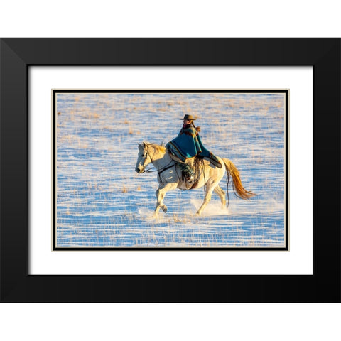 USA- Shell- Wyoming. Hideout Ranch cowgirl riding her horse in the snow.  Black Modern Wood Framed Art Print with Double Matting by Gulin, Darrell