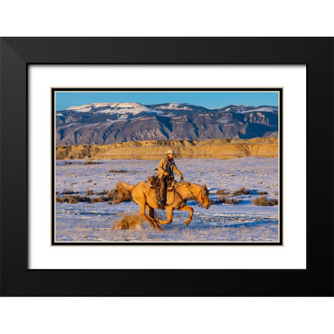 USA- Shell- Wyoming. Hideout Ranch cowgirl riding fast snows.  Black Modern Wood Framed Art Print with Double Matting by Gulin, Darrell