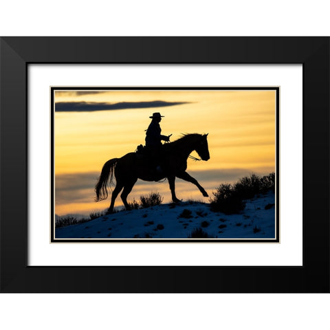 USA- Shell- Wyoming. Hideout Ranch cowgirl silhouetted on horseback at sunset.  Black Modern Wood Framed Art Print with Double Matting by Gulin, Darrell