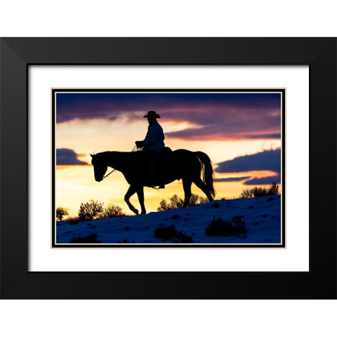 USA- Shell- Wyoming. Hideout Ranch cowboy on horseback silhouetted at sunset.  Black Modern Wood Framed Art Print with Double Matting by Gulin, Darrell