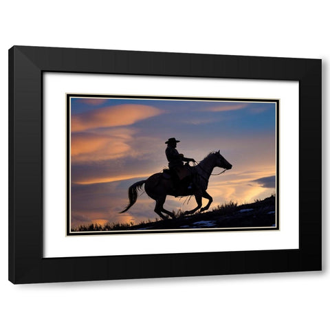 USA- Shell- Wyoming. Hideout Ranch cowboy on horseback silhouetted at sunset.  Black Modern Wood Framed Art Print with Double Matting by Gulin, Darrell