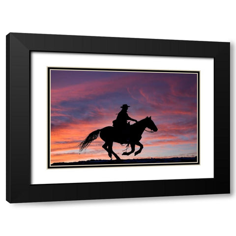 USA- Shell- Wyoming. Hideout Ranch cowgirl silhouetted on horseback at sunset.  Black Modern Wood Framed Art Print with Double Matting by Gulin, Darrell
