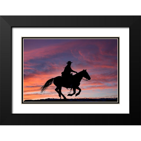 USA- Shell- Wyoming. Hideout Ranch cowgirl silhouetted on horseback at sunset.  Black Modern Wood Framed Art Print with Double Matting by Gulin, Darrell