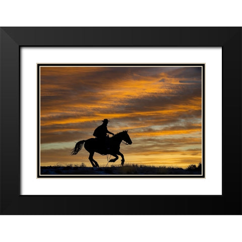 USA- Shell- Wyoming. Hideout Ranch cowgirl silhouetted on horseback at sunset.  Black Modern Wood Framed Art Print with Double Matting by Gulin, Darrell