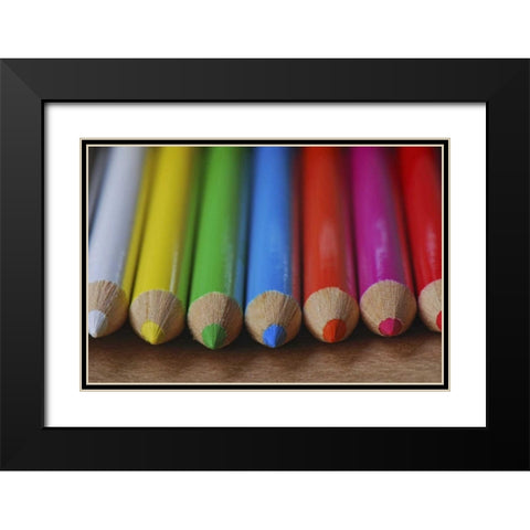 Row of multicolored colored pencils lay on table Black Modern Wood Framed Art Print with Double Matting by Terrill, Steve
