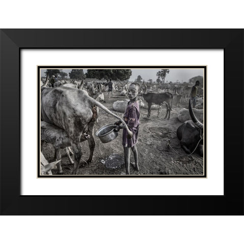 Mundari Child Filling The Container With Cow Urine - South Sudan Black Modern Wood Framed Art Print with Double Matting by Inazio Kuesta, Joxe