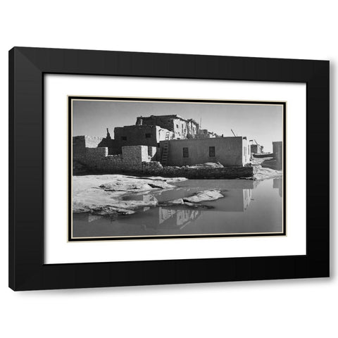 Adobe House with Water in Foreground - Acoma Pueblo, New Mexico - National Parks and Monuments, ca.  Black Modern Wood Framed Art Print with Double Matting by Adams, Ansel