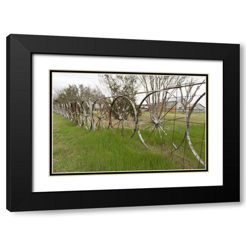 A fence made of wagon wheels near Schulenburg in Fayette County, TX Black Modern Wood Framed Art Print with Double Matting by Highmith, Carol
