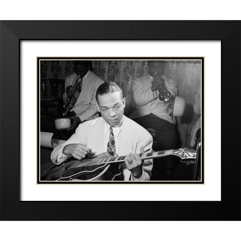 Fred Guy playing guitar at the Aquarium-New York 1946 Black Modern Wood Framed Art Print with Double Matting by Gottlieb, William