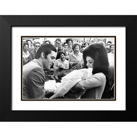 Elvis Presley and Priscilla with Lisa Marie-1968 Black Modern Wood Framed Art Print with Double Matting by Vintage Music Archive