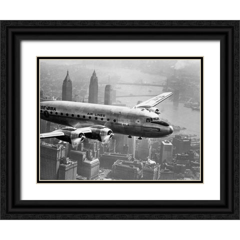 Aircraft Flying over City 1946 Black Ornate Wood Framed Art Print with Double Matting by Anonymous