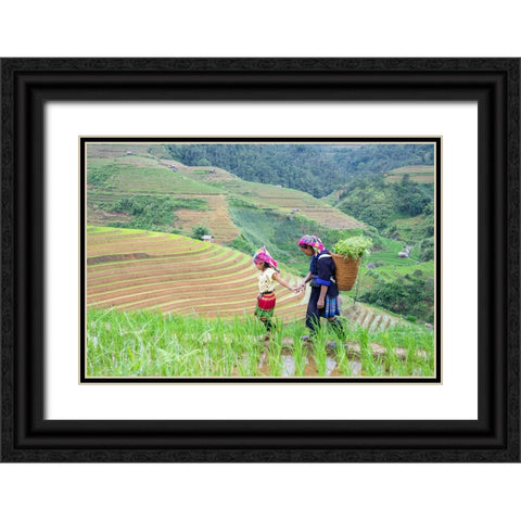 Vietnam-Grandma taking care of granddaughter-Farming community with traditional Sapa dresses Black Ornate Wood Framed Art Print with Double Matting by Norring, Tom