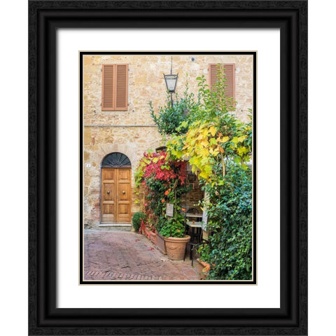 Italy-Tuscany-Pienza Doorway surrounded by flowers Black Ornate Wood Framed Art Print with Double Matting by Eggers, Julie