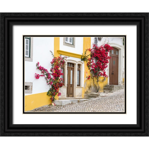 Portugal-Obidos-Dark pink bougainvillea vine growing along side the entrance of a home in the walle Black Ornate Wood Framed Art Print with Double Matting by Eggers, Julie