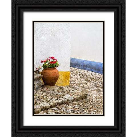Portugal-Obidos-Red geranium growing in a terra cotta pot next to the entrance of a home in the his Black Ornate Wood Framed Art Print with Double Matting by Eggers, Julie