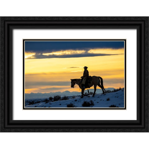 USA- Shell- Wyoming. Hideout Ranch cowgirl silhouetted on horseback at sunset.  Black Ornate Wood Framed Art Print with Double Matting by Gulin, Darrell