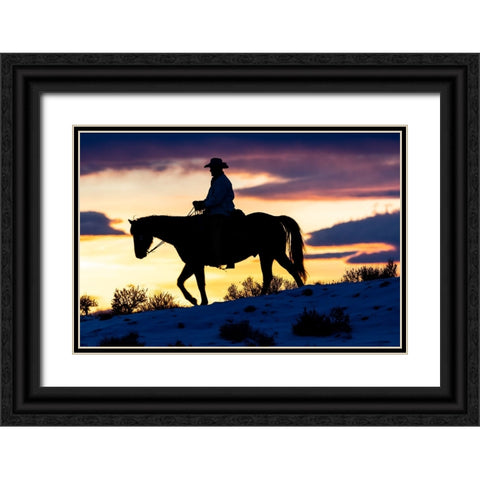 USA- Shell- Wyoming. Hideout Ranch cowboy on horseback silhouetted at sunset.  Black Ornate Wood Framed Art Print with Double Matting by Gulin, Darrell