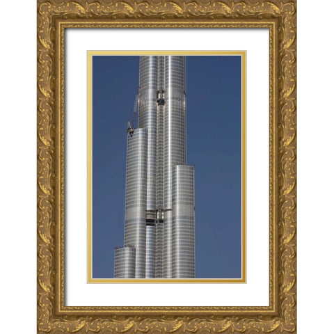UAE, Dubai Tall skyscraper under construction Gold Ornate Wood Framed Art Print with Double Matting by Young, Bill