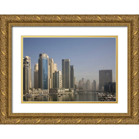 UAE, Dubai Marina towers with boats at anchor Gold Ornate Wood Framed Art Print with Double Matting by Young, Bill