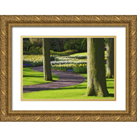Holland, Lisse Curving path through a gardens Gold Ornate Wood Framed Art Print with Double Matting by Flaherty, Dennis