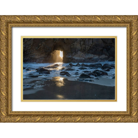 Sun shines through a tunnel in a sea cliff in the Big Sur area. Gold Ornate Wood Framed Art Print with Double Matting by Sederquist, Betty