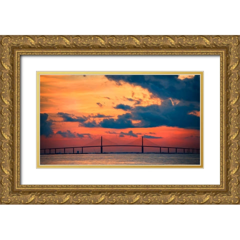 The Skyway Bridge over the Gulf of Mexico with the reds and oranges of the sunrise in the sky Gold Ornate Wood Framed Art Print with Double Matting by Haddad, Sheila