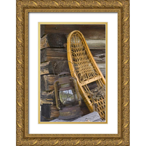MT, A lantern and snowshoe outside a log cabin Gold Ornate Wood Framed Art Print with Double Matting by Paulson, Don
