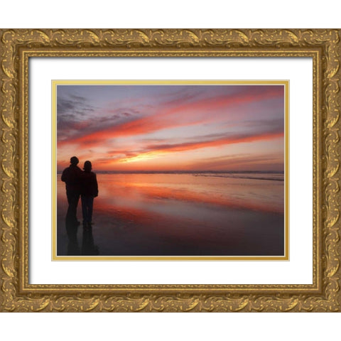 Oregon, Cannon Beach Couple on beach at sunset Gold Ornate Wood Framed Art Print with Double Matting by Paulson, Don