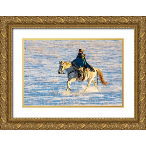 USA- Shell- Wyoming. Hideout Ranch cowgirl riding her horse in the snow.  Gold Ornate Wood Framed Art Print with Double Matting by Gulin, Darrell
