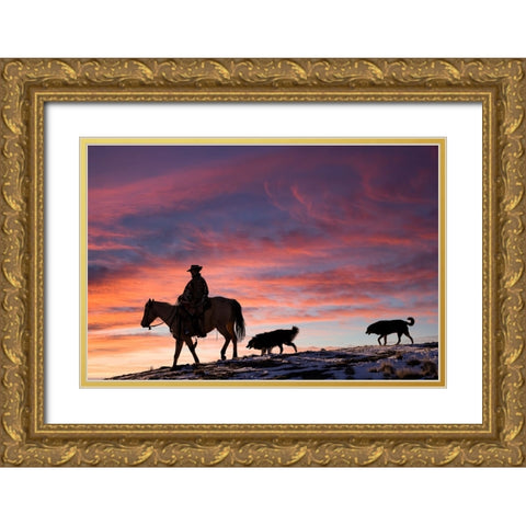 USA- Shell- Wyoming. Hideout Ranch cowgirl and her two dogs horseback riding at sunset.  Gold Ornate Wood Framed Art Print with Double Matting by Gulin, Darrell