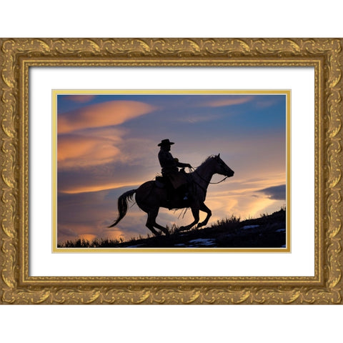 USA- Shell- Wyoming. Hideout Ranch cowboy on horseback silhouetted at sunset.  Gold Ornate Wood Framed Art Print with Double Matting by Gulin, Darrell