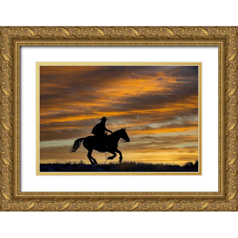 USA- Shell- Wyoming. Hideout Ranch cowgirl silhouetted on horseback at sunset.  Gold Ornate Wood Framed Art Print with Double Matting by Gulin, Darrell