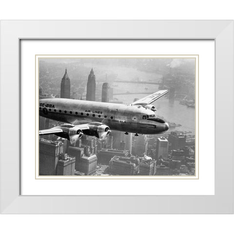 Aircraft Flying over City 1946 White Modern Wood Framed Art Print with Double Matting by Anonymous