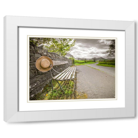 Bench with a hat on countryside road White Modern Wood Framed Art Print with Double Matting by Frank, Assaf