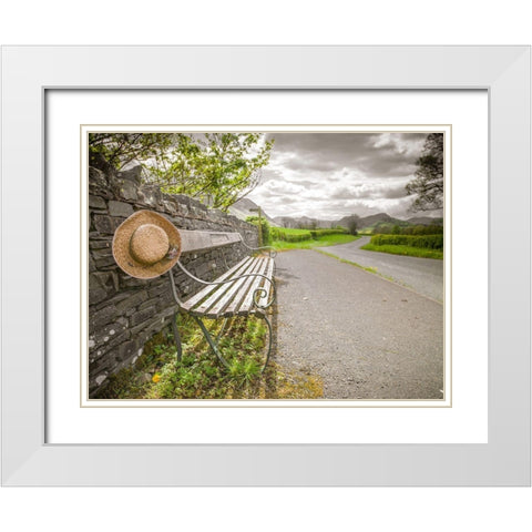 Bench with a hat on countryside road White Modern Wood Framed Art Print with Double Matting by Frank, Assaf